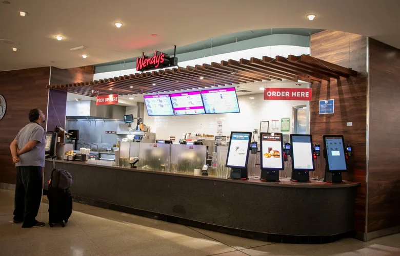 Customer standing in front of Wendy's at SFO